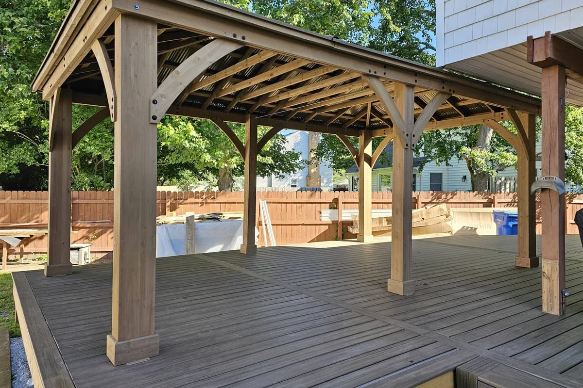 Completed wooden gazebo on a backyard deck