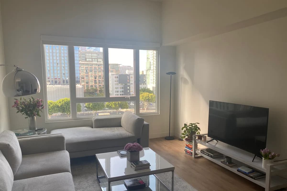 Installed window shade in a furnished living room